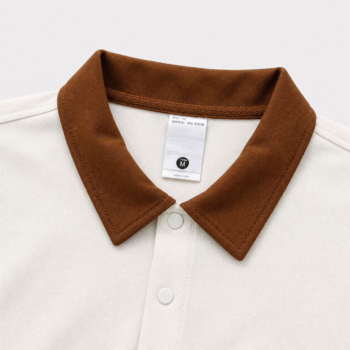 POLO NIKE BOXY CREMA
